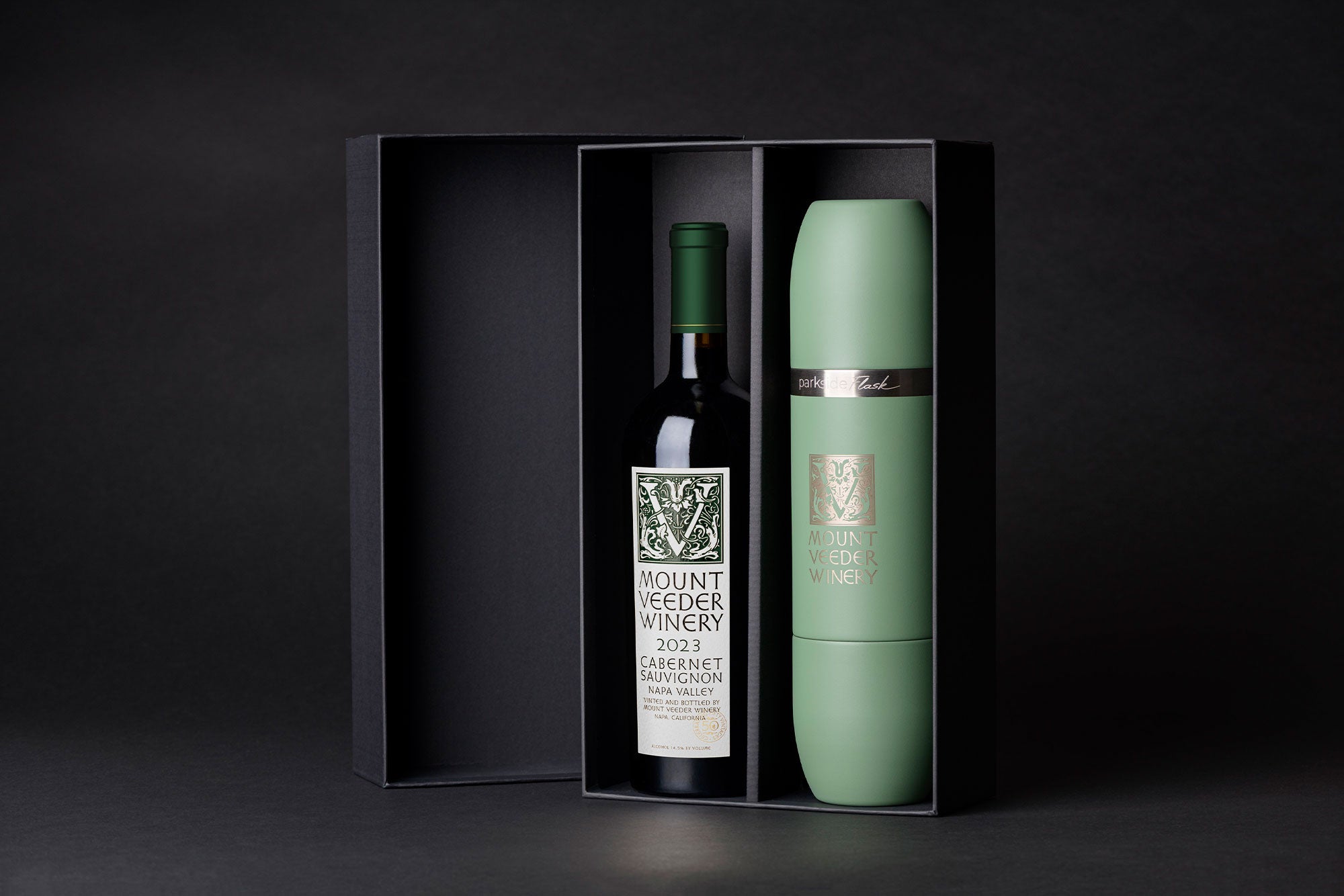 Wine bottle, green Parkside flask, and gift box with 'Mount Veeder Winery' branding on a black background.