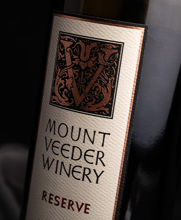 A close up of the label on a bottle of 2014 Mount Veeder Reserve Red Blend Napa Valley