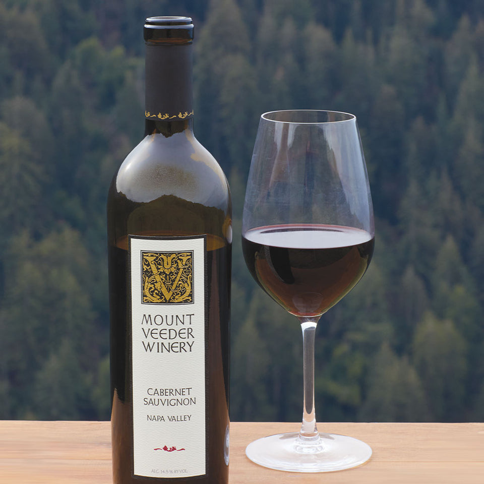 Mount Veeder Cabernet Sauvignon Bottle with vineyard in the background.